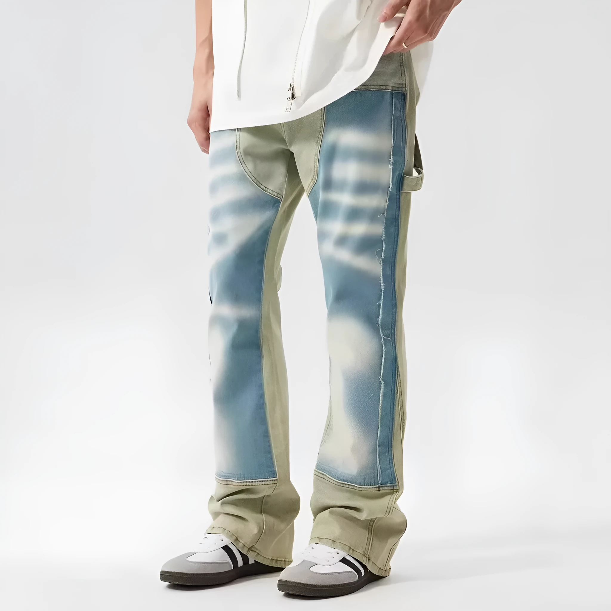 Yellow and blue retro patchwork jeans with splash-ink distressed design and zip fly.