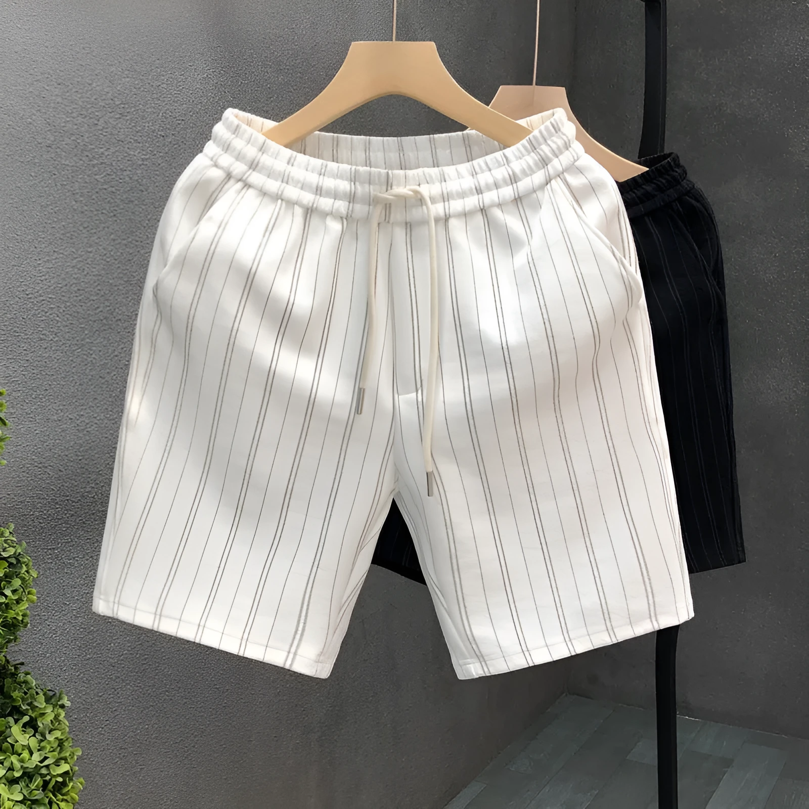 Men's black and white striped fleece-lined casual shorts with an elastic waistband