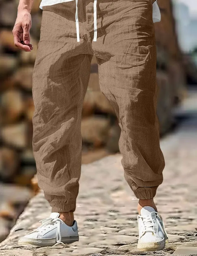 Men's straight-leg cotton trousers with elastic waist in apricot colour on a hanger