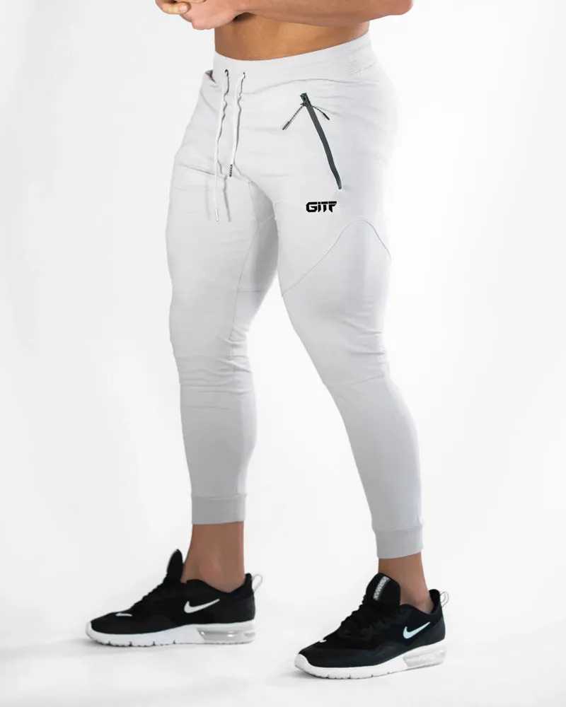 Men's camouflage quick dry jogging trousers in slim fit style from front view on plain background
