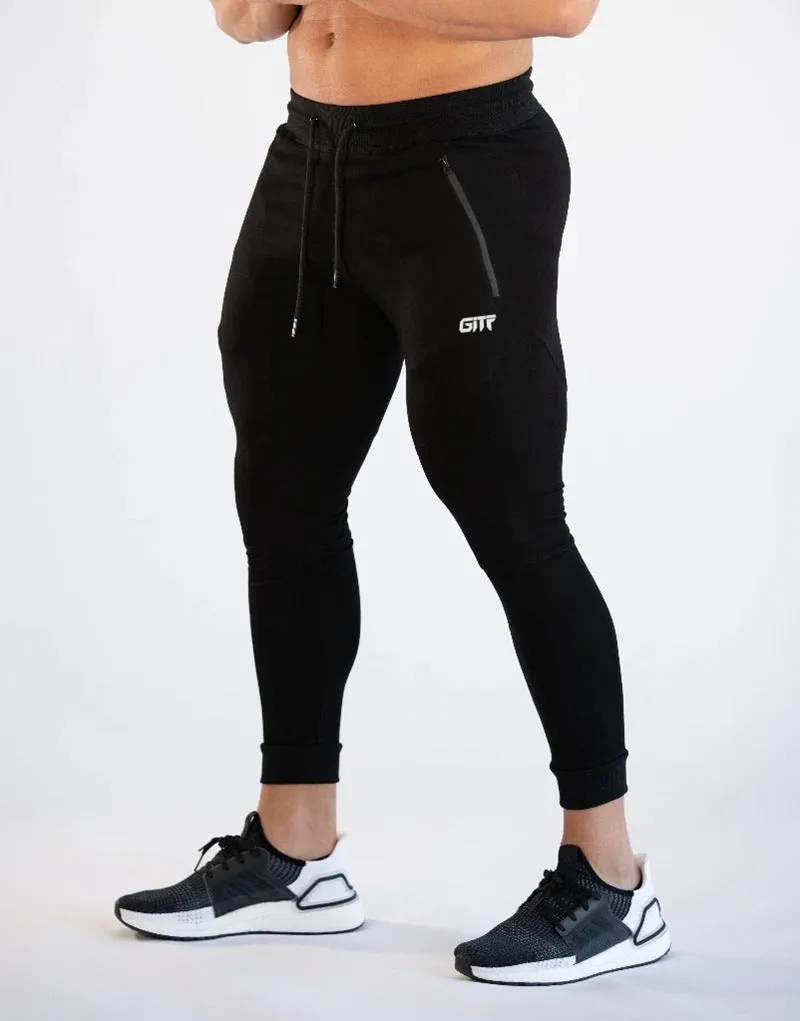 Men's camouflage quick dry jogging trousers in slim fit style from front view on plain background