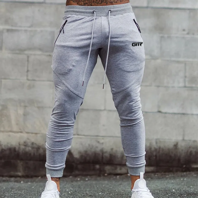 Men's camouflage quick dry jogging trousers in slim fit style from front view on plain background
