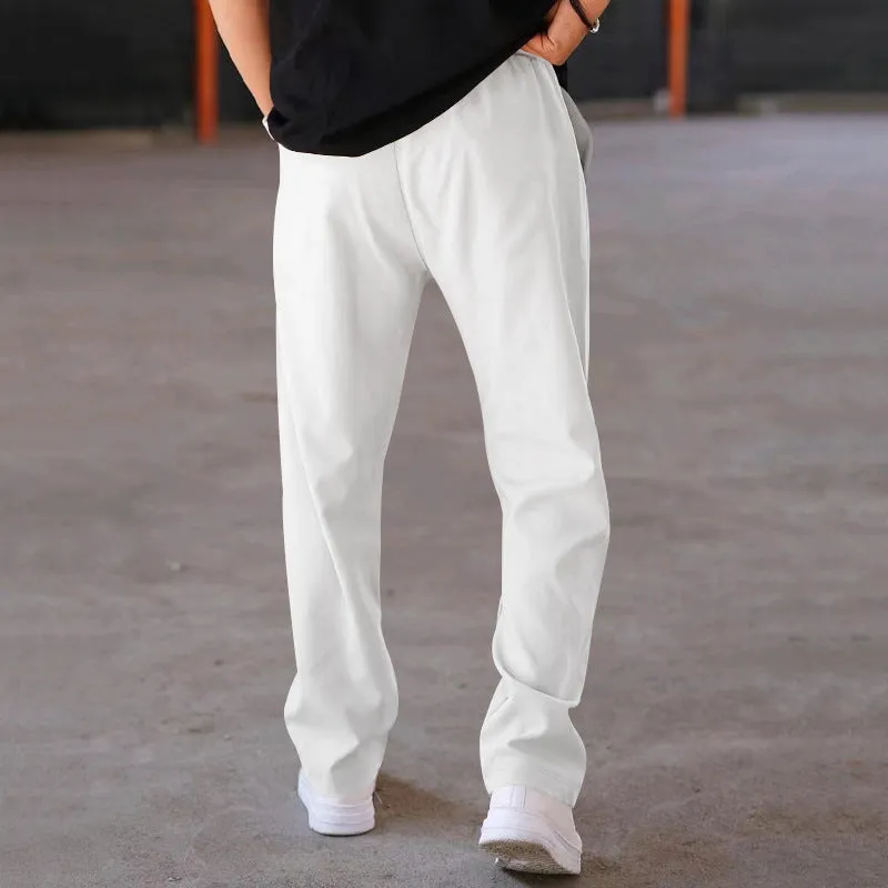 Men's loose straight drawstring trousers in waffle polyester fabric, shown in multiple colour options