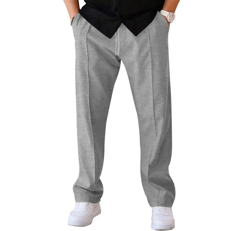 Men's loose straight drawstring trousers in waffle polyester fabric, shown in multiple colour options