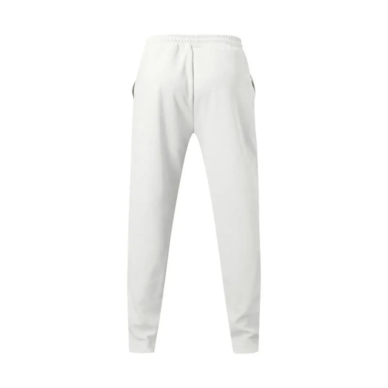Men's loose straight drawstring trousers in waffle polyester fabric, shown in multiple colour options