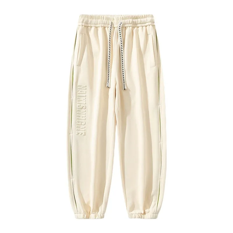 Men's loose cotton trousers with stitching detailing and ankle banding in grey green colour