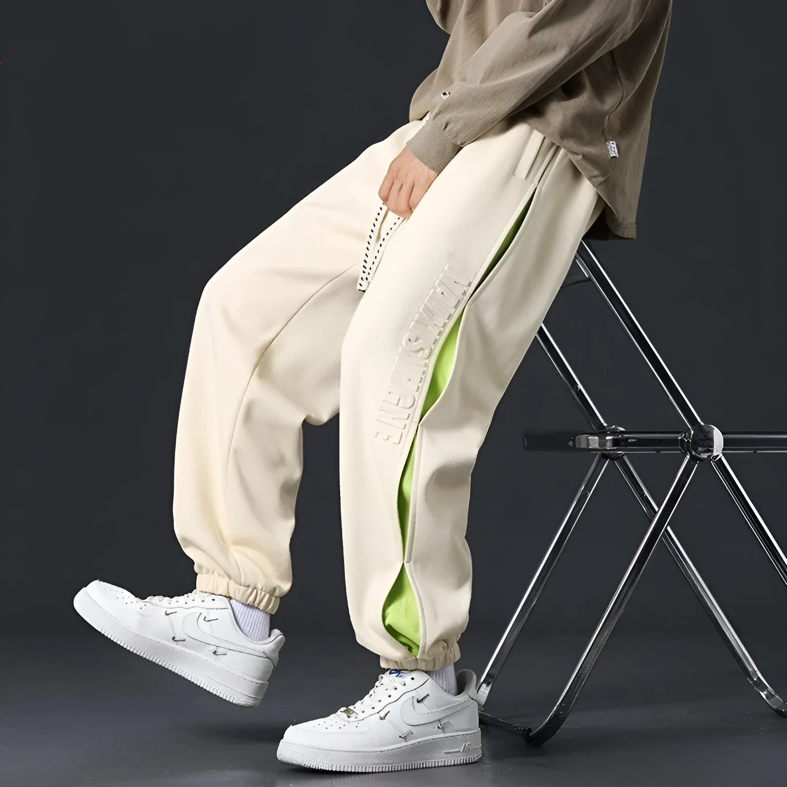 Men's loose cotton trousers with stitching detailing and ankle banding in grey green colour