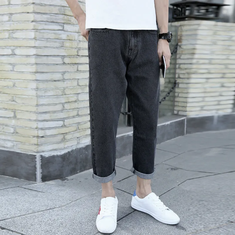 Men's black loose straight leg harem jeans on hanger