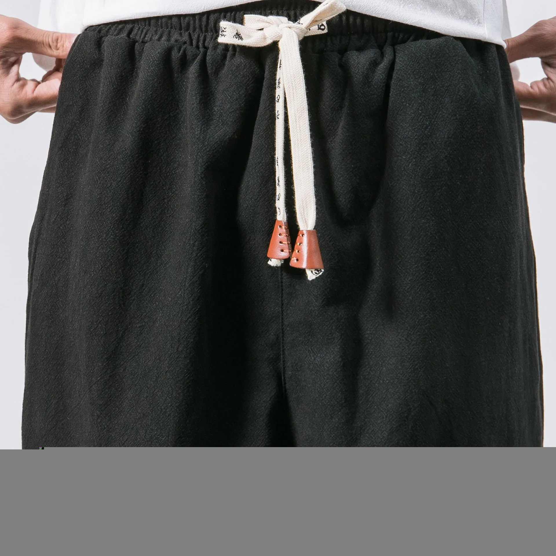 Men's black cotton hip hop streetwear joggers with drawstring waist and slant pockets