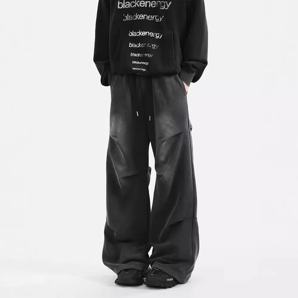 Men's pleated straight loose sweatpants in black and grey, cotton fabric, elastic waist, American washed finish.