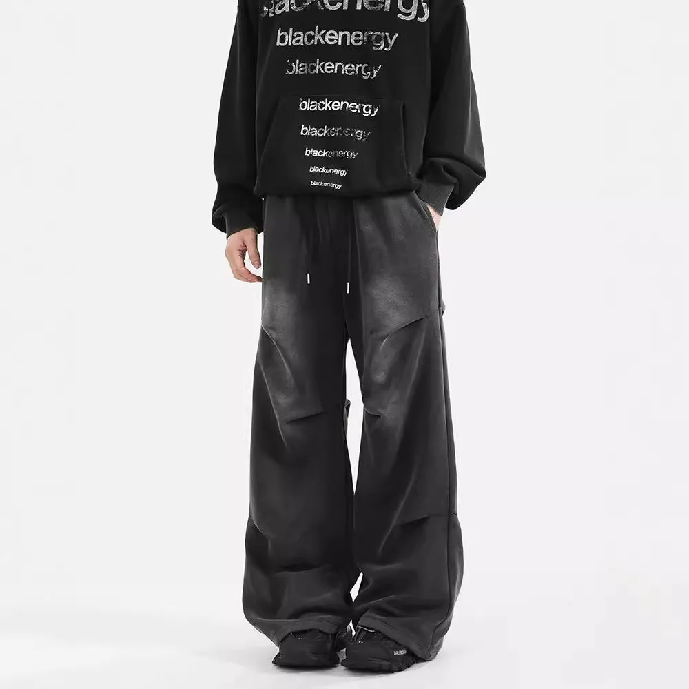 Men's pleated straight loose sweatpants in black and grey, cotton fabric, elastic waist, American washed finish.