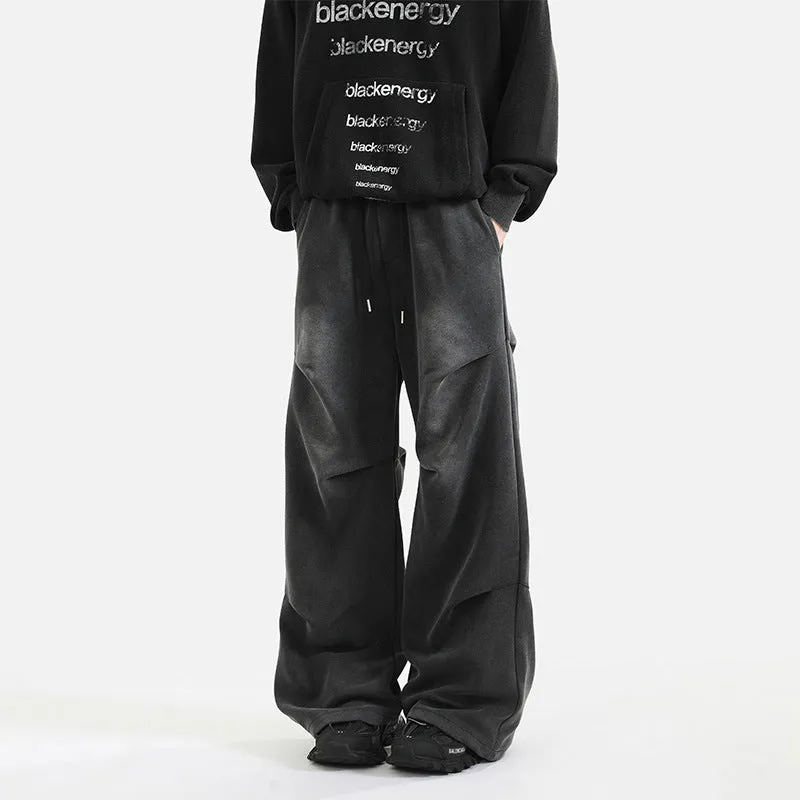 Men's pleated straight loose sweatpants in black and grey, cotton fabric, elastic waist, American washed finish.
