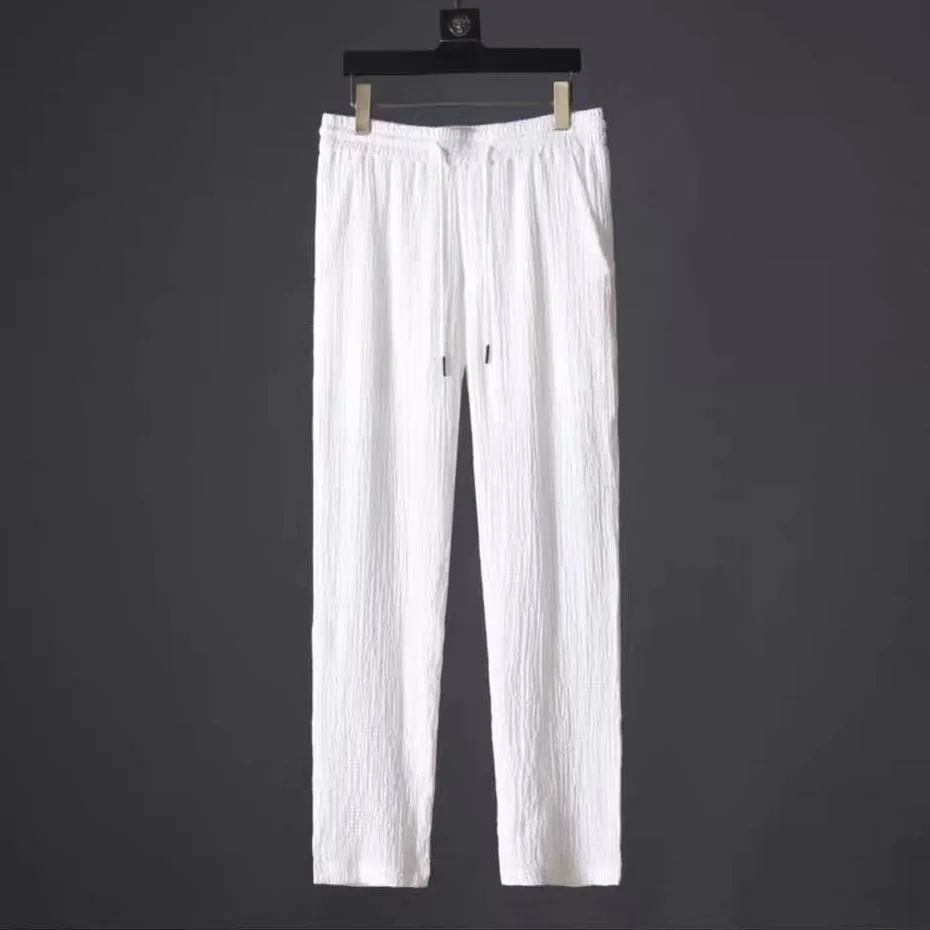 Leisure suit summer loose short sleeve top and drawstring trousers for men, polyester fabric, black and white option