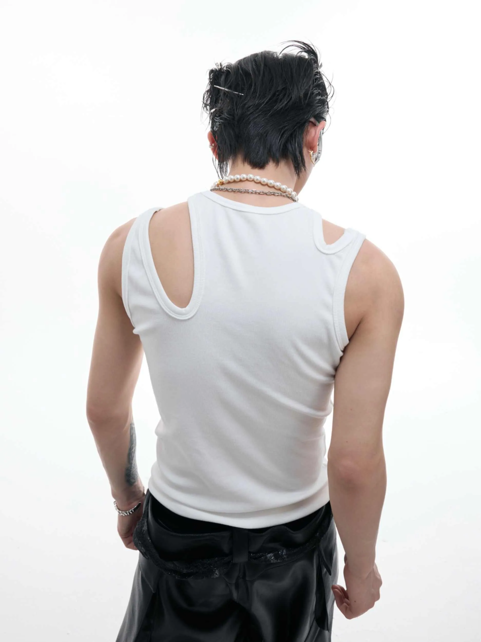 Retro crocheted hollow sleeveless polyester top with metal decoration in white, front view, slim fit