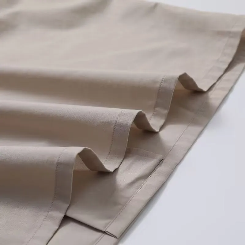 Men's and women's open collar solid colour shirt in beige with half sleeves and front pocket, loose fit