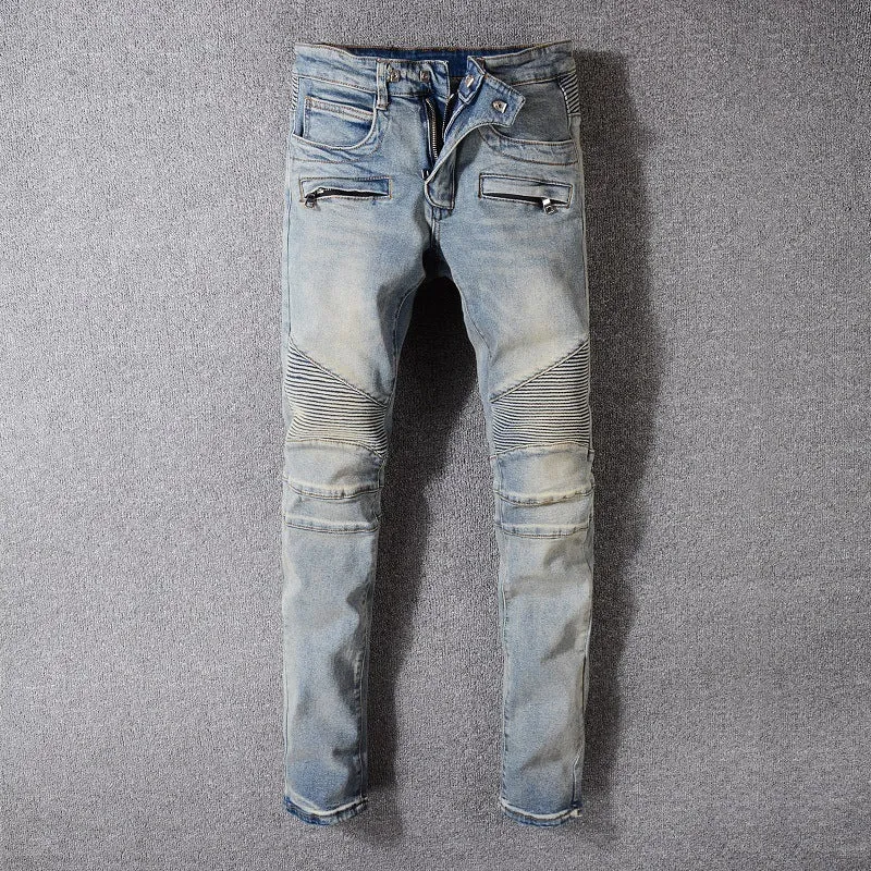 Grey biker jeans with straight tube leg, mid-rise waist, zipper fly, and distressed denim finish