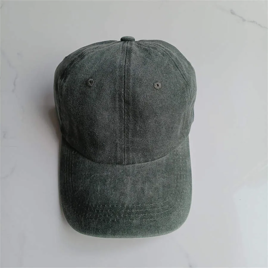 Retro washed cotton baseball cap in Army Green with dome crown and adjustable strap
