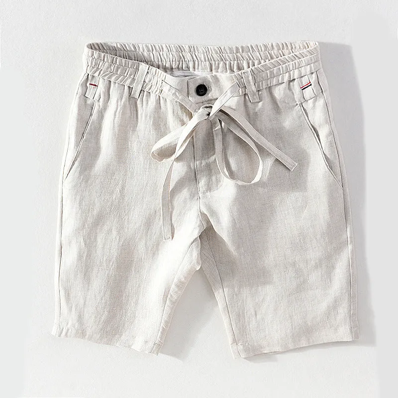 Men's 100% linen straight shorts in black, front view, mid-waist with zipper fly and pocket detail