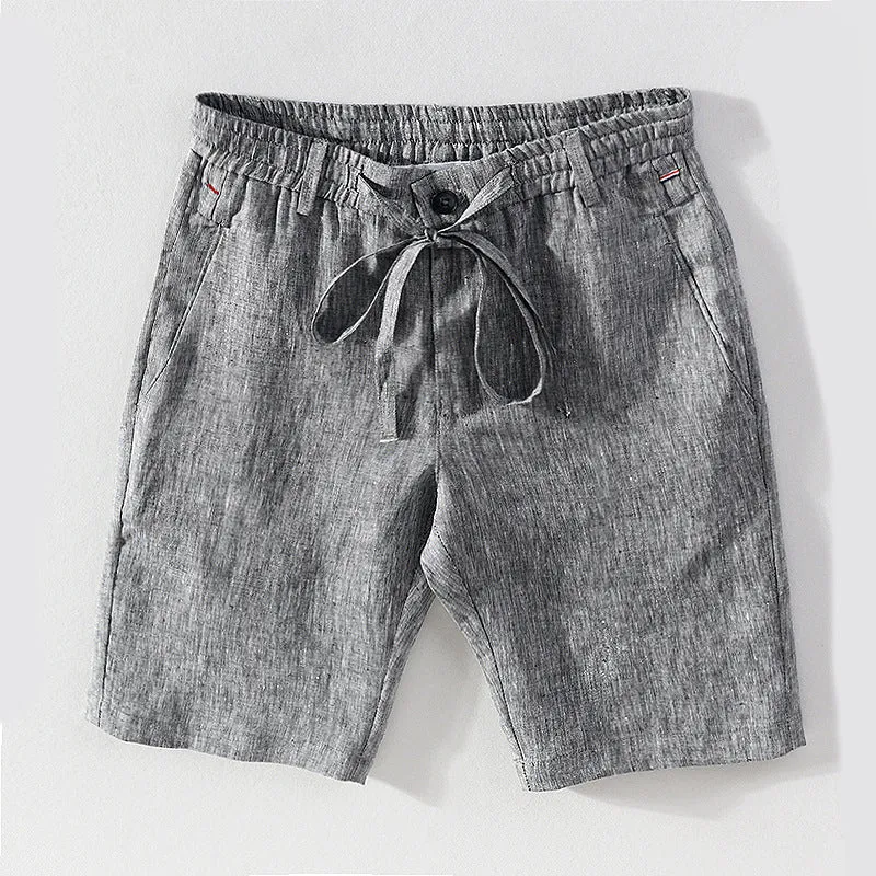 Men's 100% linen straight shorts in black, front view, mid-waist with zipper fly and pocket detail