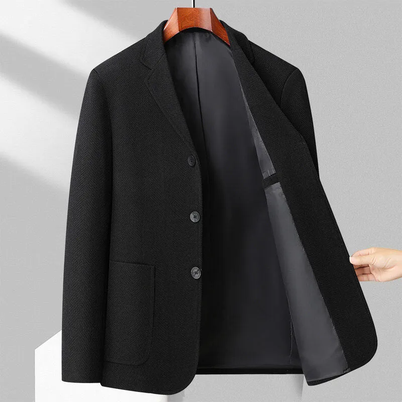 A man wearing a simple, loose-fit solid-colour woolen coat suitable for spring or autumn.