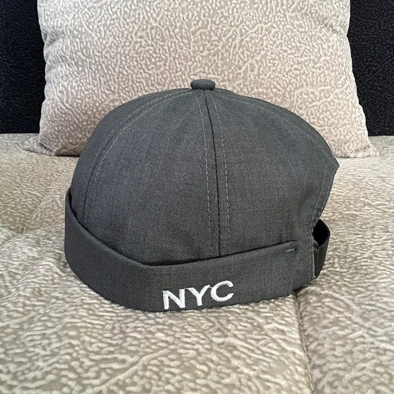 Cotton baseball cap with letter pattern and rivet details, adjustable no brim, seasonal wear