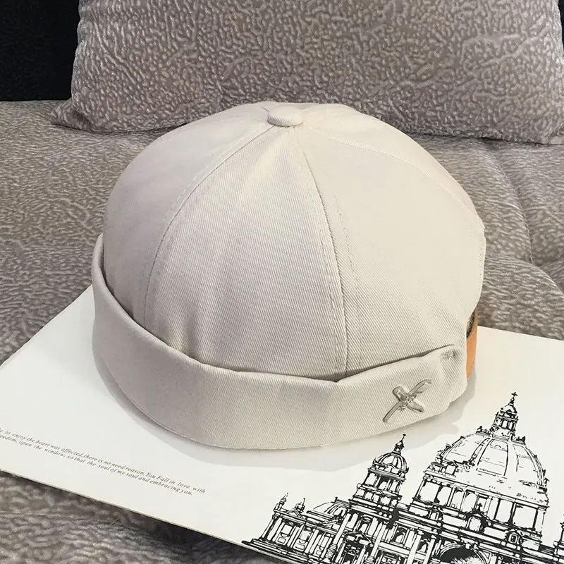 Cotton baseball cap with letter pattern and rivet details, adjustable no brim, seasonal wear