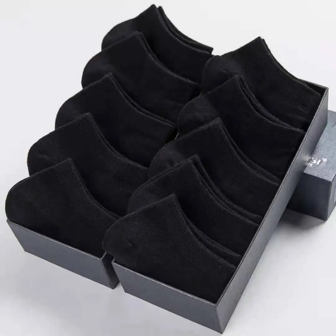 Solid colour men's low cut socks in black, grey, and white with seamless toe construction and blended fabric for breathability.
