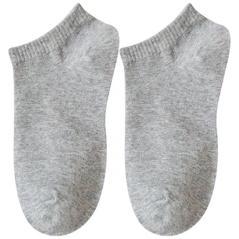 Solid colour men's low cut socks in black, grey, and white with seamless toe construction and blended fabric for breathability.