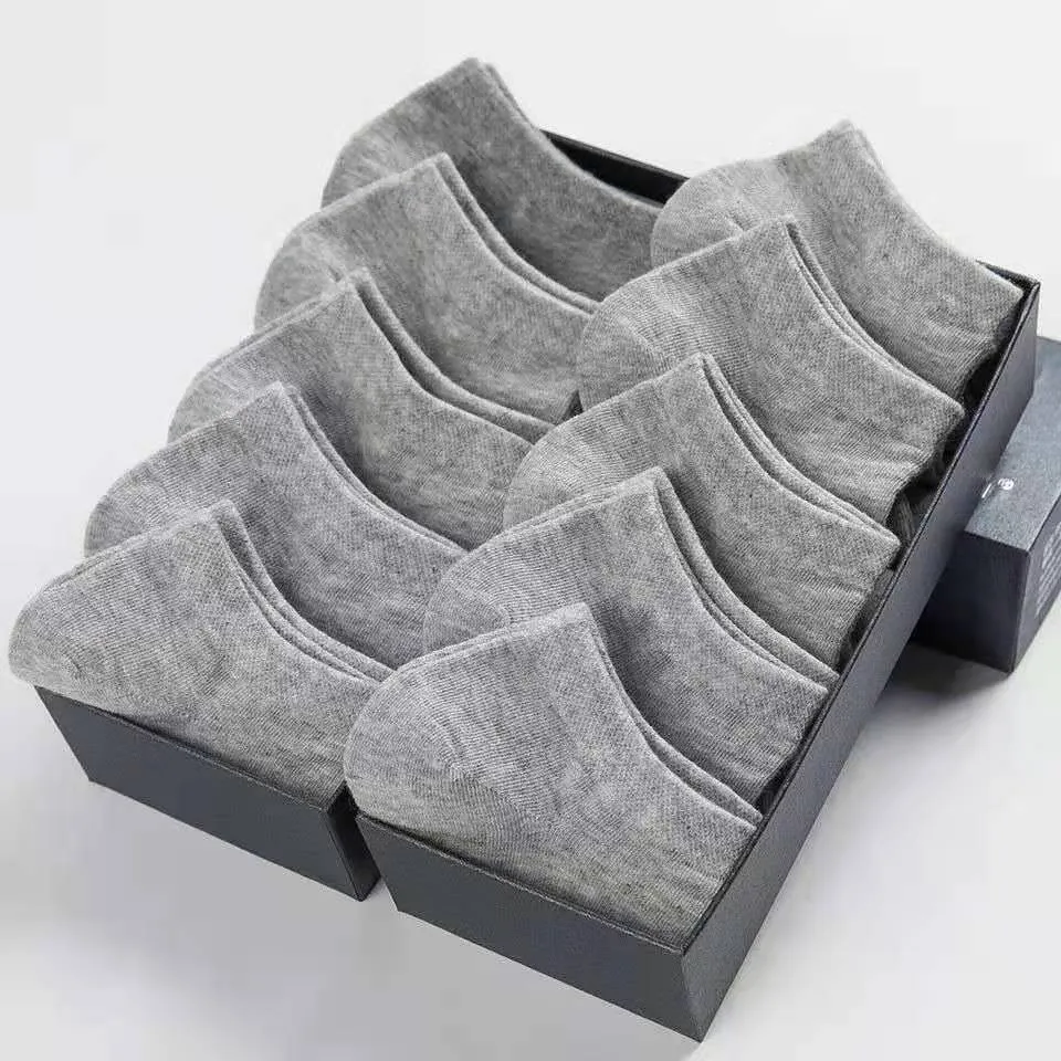 Solid colour men's low cut socks in black, grey, and white with seamless toe construction and blended fabric for breathability.