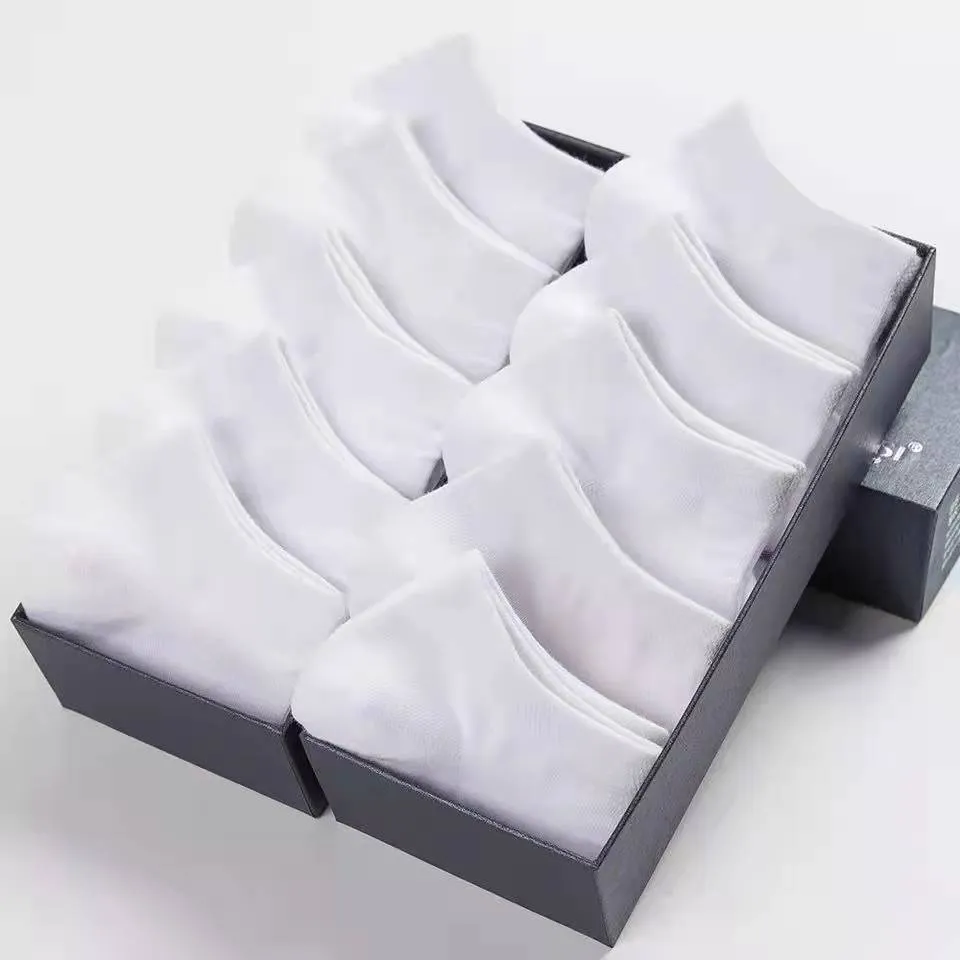 Solid colour men's low cut socks in black, grey, and white with seamless toe construction and blended fabric for breathability.