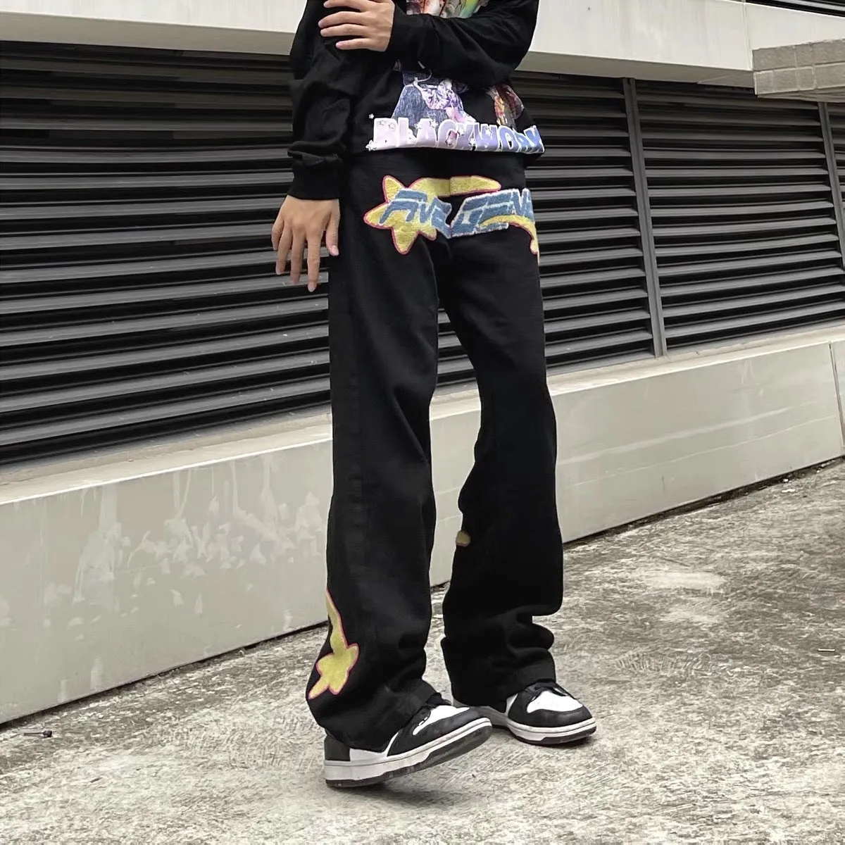 Mens casual print loose jeans in black, showing elasticated waist and relaxed fit