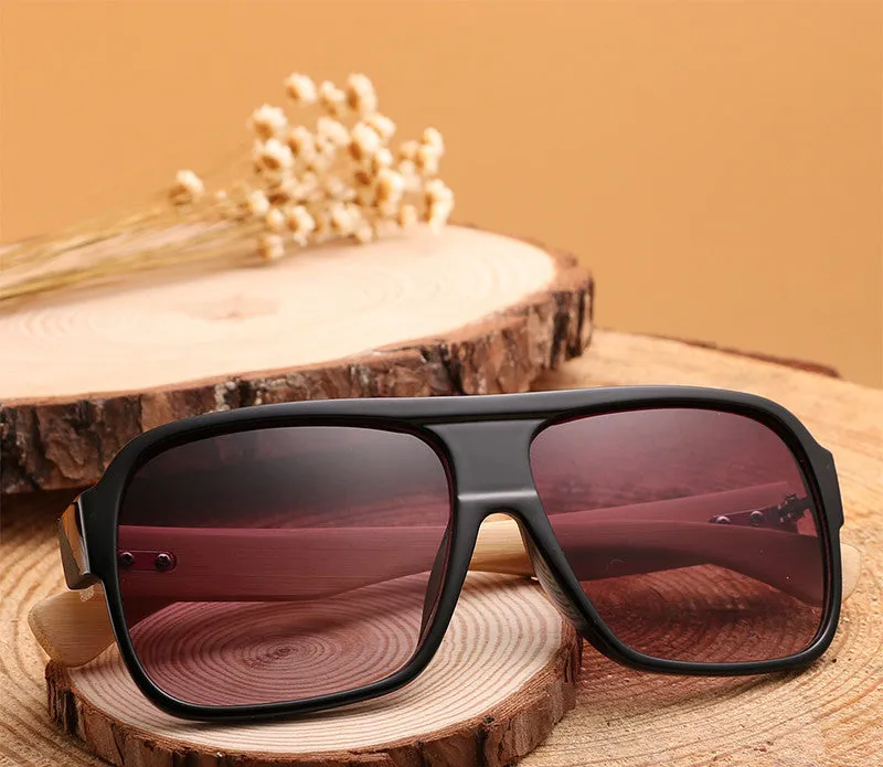 Wooden square sunglasses with brown frame and PC lenses on a flat surface
