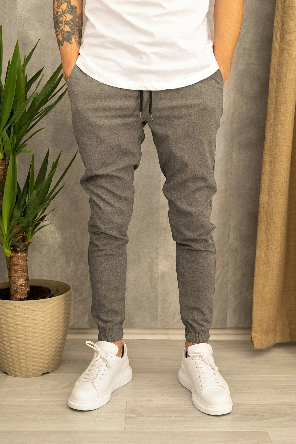 Men's casual plain cotton trousers with belt, tight-fitting pencil pants style, available in black grey khaki