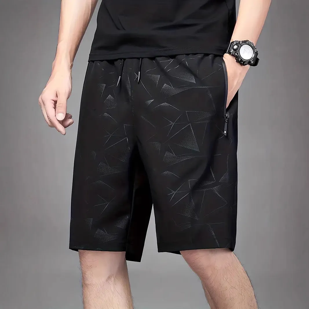 Men's loose fit sports shorts with printed patterns in polyester fabric available in black grey blue colours
