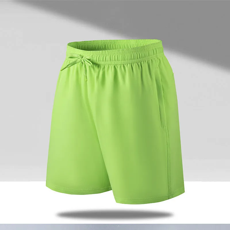 Man wearing loose fit quick-dry polyester beach shorts in a summer colour