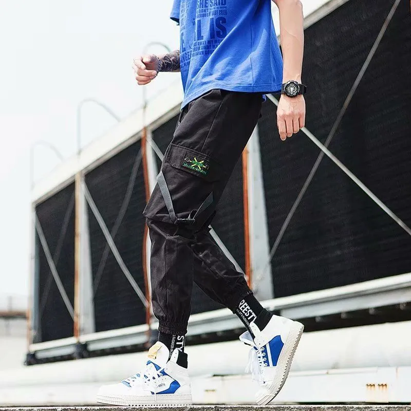 Hip hop jogger pants in khaki cotton fabric with elastic cuffs, shown flat