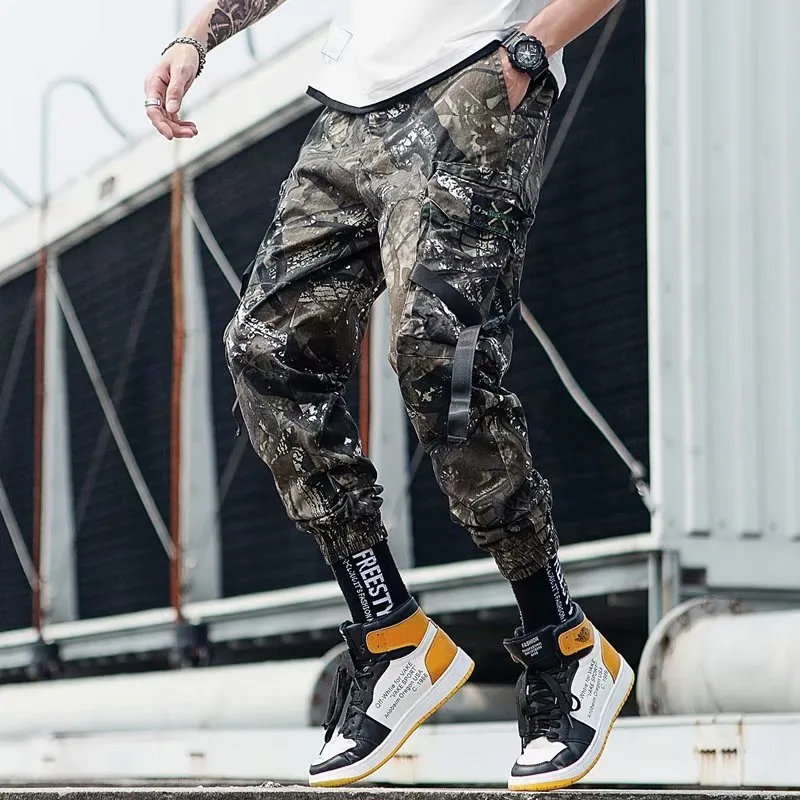 Hip hop jogger pants in khaki cotton fabric with elastic cuffs, shown flat