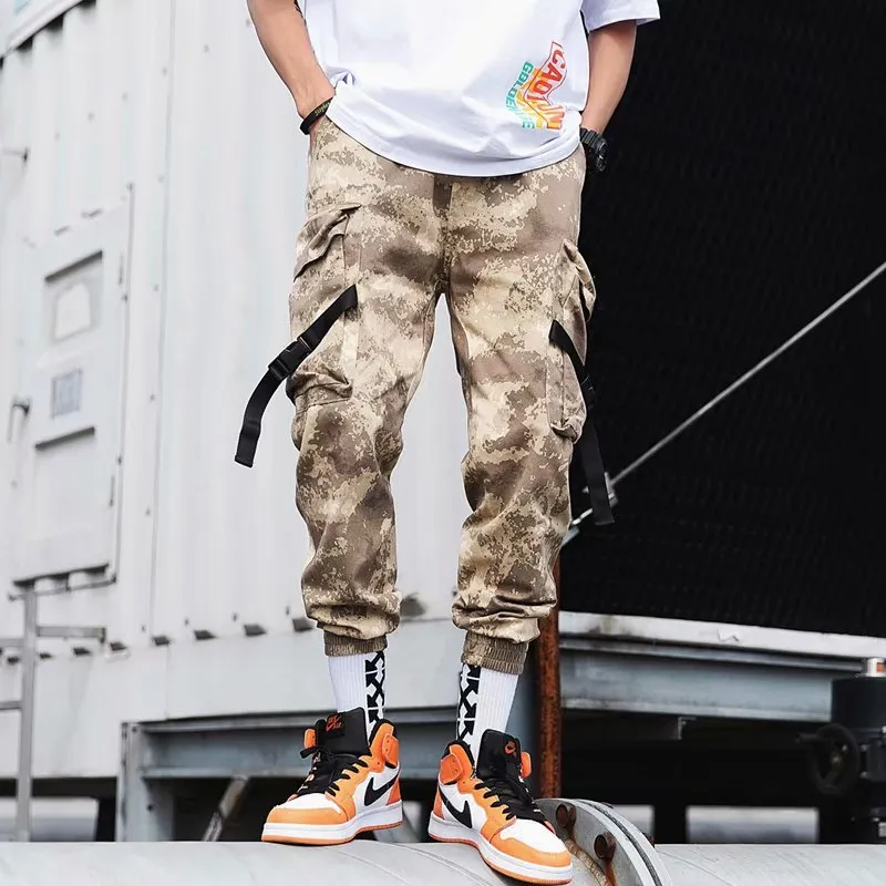 Hip hop jogger pants in khaki cotton fabric with elastic cuffs, shown flat