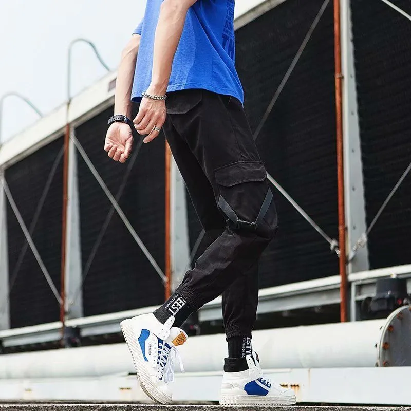 Hip hop jogger pants in khaki cotton fabric with elastic cuffs, shown flat