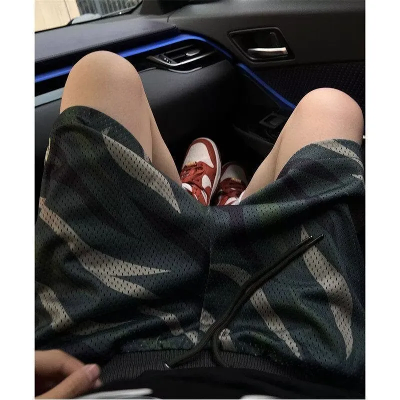 Men's camouflage mesh shorts in straight leg design with cotton blend fabric