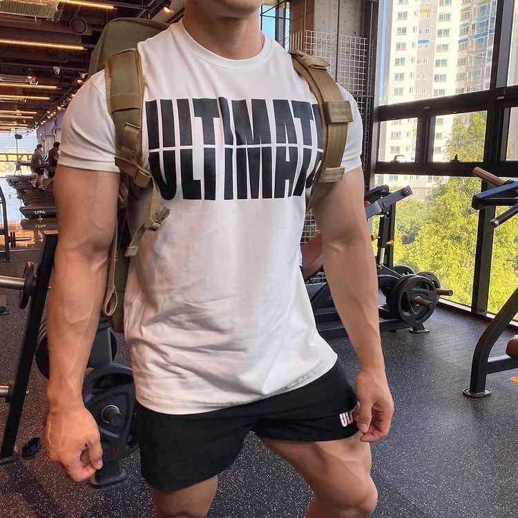 Men's cotton short sleeve round neck gym training top in black and white colourway on model
