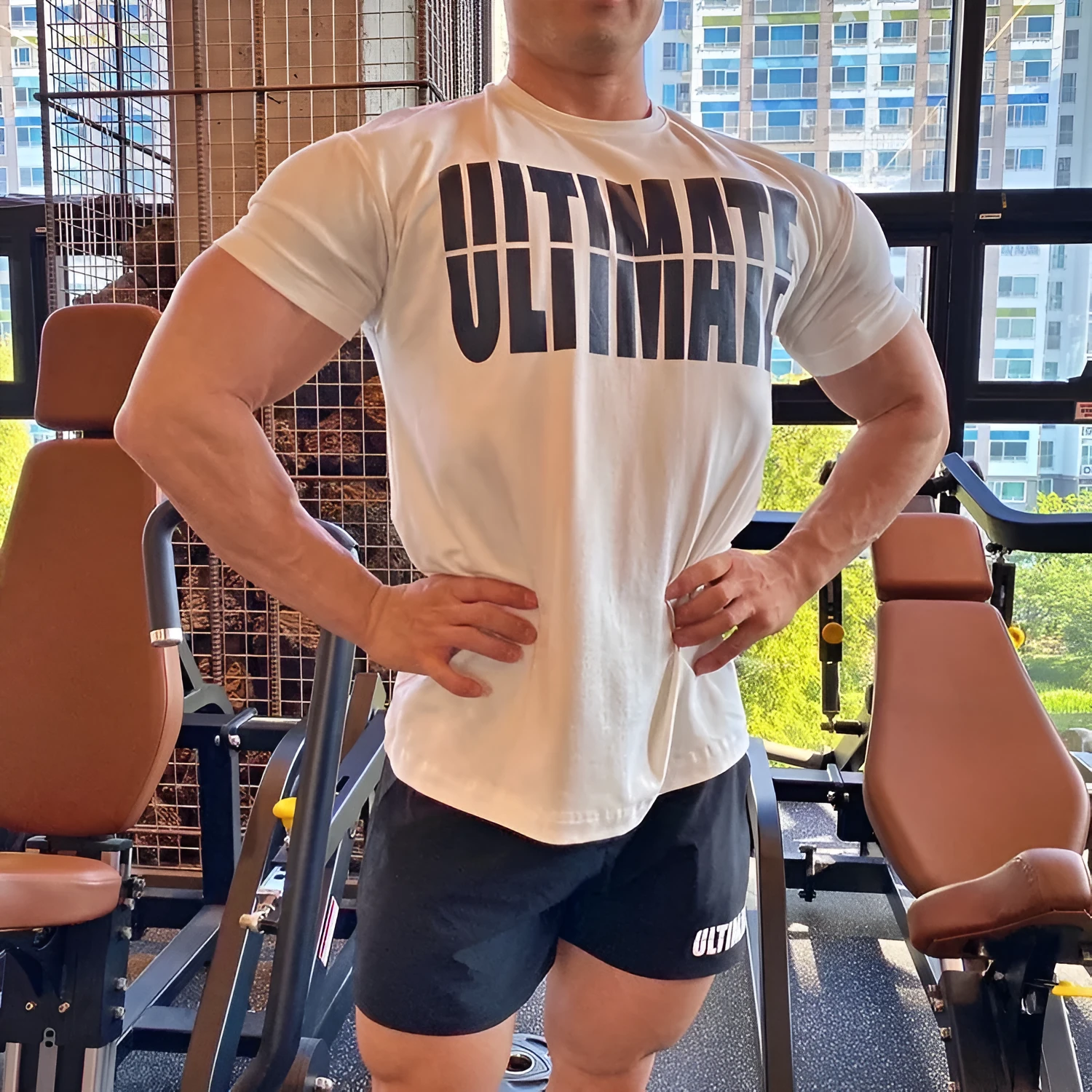 Men's cotton short sleeve round neck gym training top in black and white colourway on model
