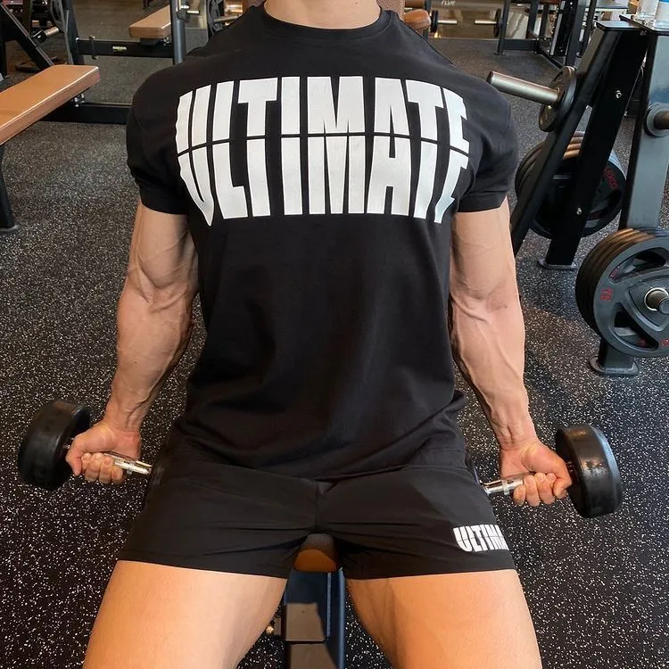 Men's cotton short sleeve round neck gym training top in black and white colourway on model