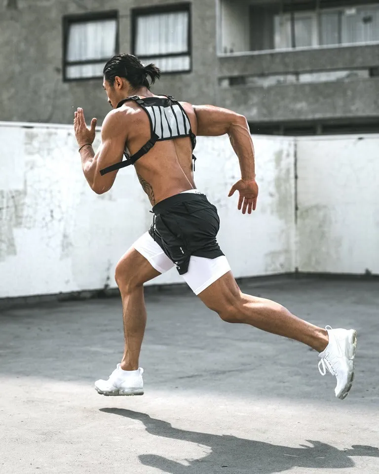 Men's quick-drying double-layer fitness shorts in Army Green with loose fit and moisture-wicking polyester fabric