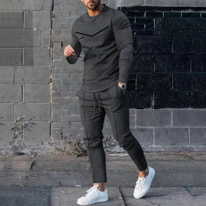 Men's cotton blend round neck long sleeve T-shirt and trousers tracksuit set in light gray on a plain background