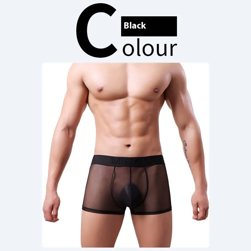 Men's thin polyester boxer shorts in solid colours including black, white, blue, and pink