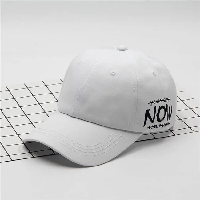 Cotton baseball cap with letter embroidery, adjustable back, curved brim, in beige on white background