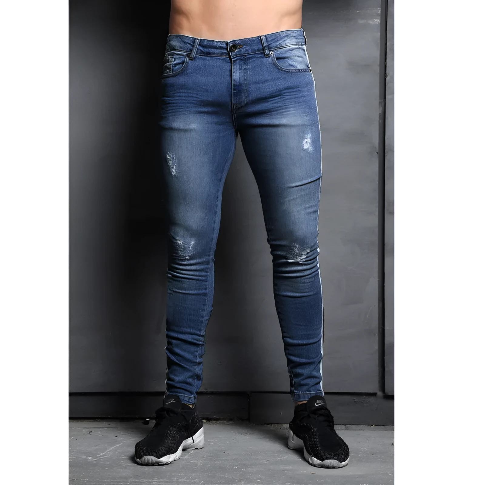 Men's black slim fit wish jeans with knee holes and mid waist design