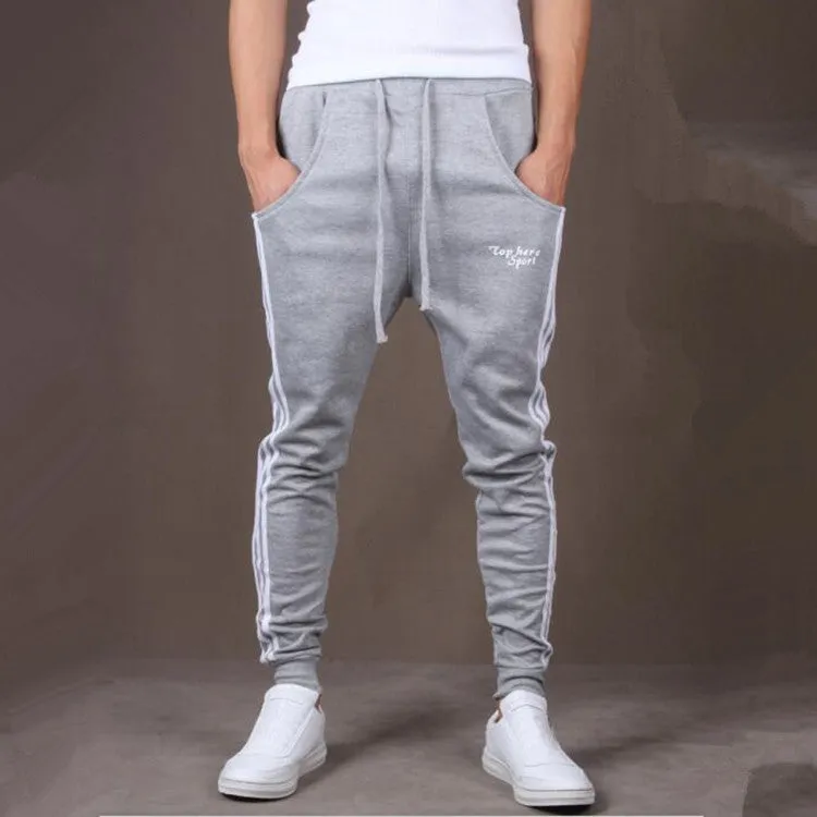 Men's straight leg cotton casual trousers with three-bar side stripe in grey, black, and navy