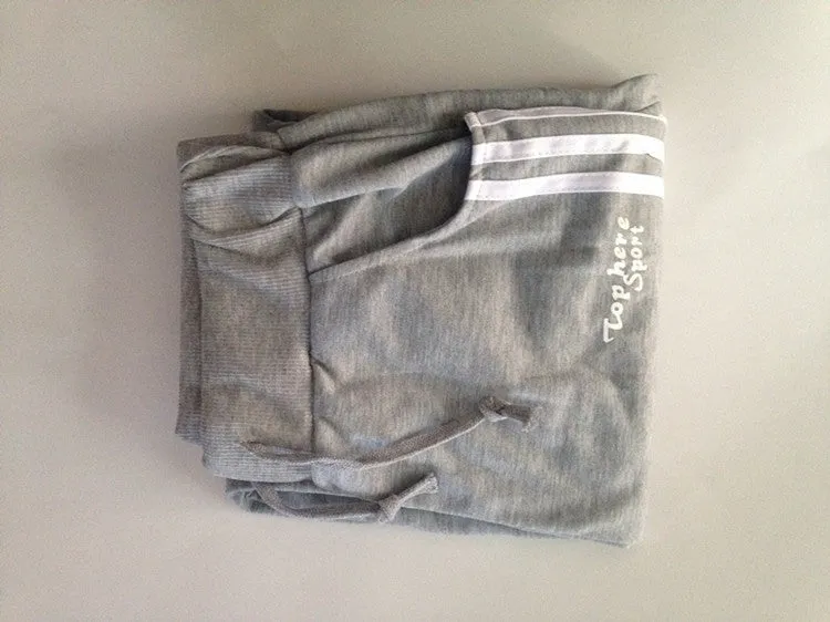 Men's straight leg cotton casual trousers with three-bar side stripe in grey, black, and navy